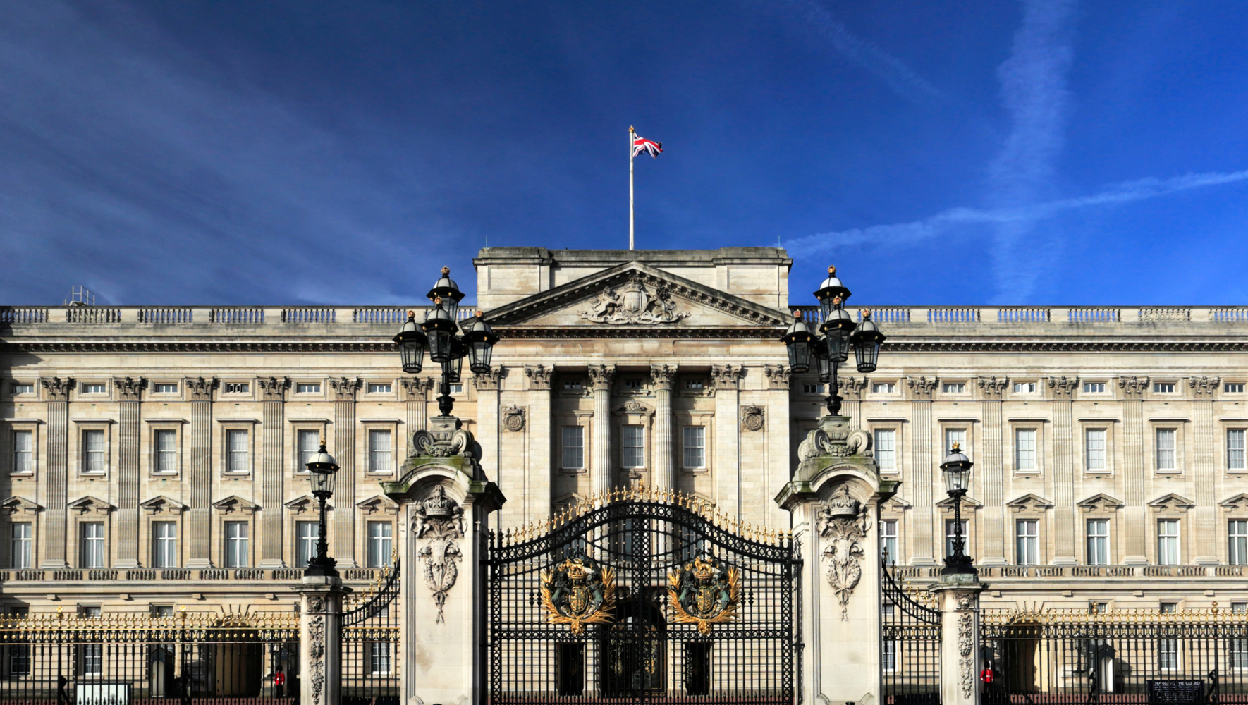 The front gates of Buckingham Palace, with the palace in the background.